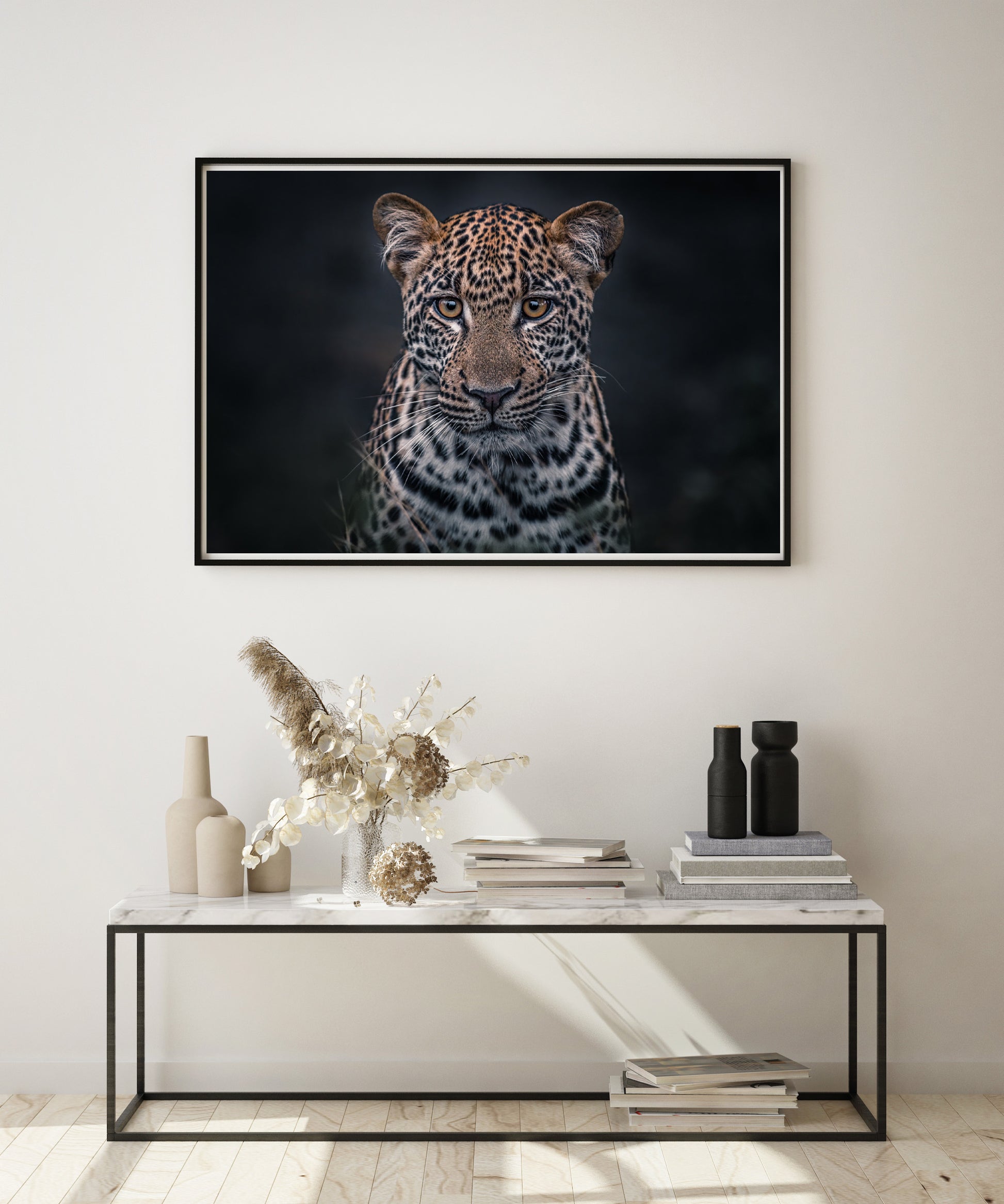 framed leopard print on living room wall